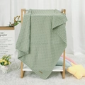 Soft green knitted baby blanket with waffle texture on wooden rack for nursery - 100*80 / Light Green