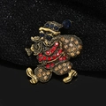 Vintage gold Santa Claus brooch featuring colorful rhinestones and festive gift bag detail - Santa Claus Style (YNCP1350)