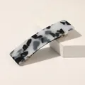 Close-up of black and white acetate hair clip with tortoise shell pattern and spring clip - Leopard White