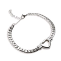 Detail of silver Cuban link bracelet featuring a hollow heart charm and lobster clasp - Bracelet / Steel