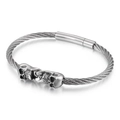Gothic silver braided steel cable bracelet with dual skulls and magnetic clasp - Skull