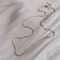 Elegante collana in acciaio al titanio intrecciato dorato con trama tessuta scintillante - Collana / Oro