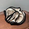 Detail of cream satin scrunchie with black piping edges on a wooden tray decor - Large / Off White