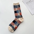 Detail of vintage plaid cotton sock in beige, navy, and red with a stylish retro pattern - One Size / Beige