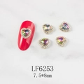Detail of 3D heart nail charms with AB crystals and gold base on marble surface - AB Color Heart Gold Base (6253)