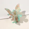 Detail view of pearlescent acetate butterfly hair claw clip with golden metal spring - Lake Green Butterfly Claw