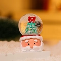 Close-up of Santa Claus base crystal ball with mini Christmas tree and snow - New Style Christmas Tree Snow Globe