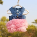 Blue denim and pink mesh pet dress with a bow on a pearl hanger in outdoor setting - Pink Denim