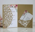 Detail of laser-cut gold wedding invitation set with floral patterns and RSVP card - Beige Gold