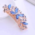 Rose gold hair clip with blue leaf-shaped stones and crystals in butterfly design - Royal Blue Butterfly