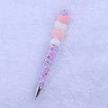 Macro detail of cartoon Valentine silicone beaded pen with purple love pattern - Pink Hearts