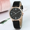 Minimalist women's quartz watch with black leather strap and gold-tone round case dial - Black