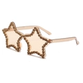 Detailed view of star shaped sunglasses featuring hand set champagne rhinestones and tinted lenses - C18-Champagne