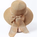 Detailed view of women's straw sun hat with large linen bow and wide brim for beach - Adjustable / Khaki