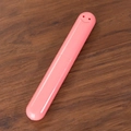 Portable pink plastic travel toothbrush case with a minimalist smiley face design - Solid Pink