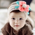Close-up of baby lace headband with pink floral detail and mint green satin ribbon - Chiffon Orange