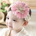 Detailed shot of pink mesh flower and white lace bow headband on a baby girl model - Water Velvet Pink