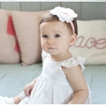 Baby headband featuring a large white fabric flower with a pink center on soft elastic - FD002 White