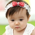 Baby girl white lace headband featuring a vibrant red and white polka dot satin bow - Red Polka Dot Bow