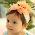 Infant lace headband featuring a large orange fabric flower and delicate white lace trim - Mesh Orange