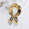 Elegant yellow silk scarf with bird and chain print in a stylish knotted display - 70x70cm / Equestrian Yellow