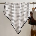 Detail of a square silk scarf with black clover print and elegant hemmed edges on a hanger - White / 68*68cm