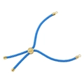 Close-up of blue braided cord with golden metal sliding buckle and cylinder end caps - Blue