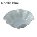 Nordic blue plastic fruit bowl featuring a ruffled edge and wave design for table decor - Nordic Blue