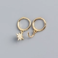 Detailed view of S925 silver star and moon asymmetric earrings with pavé crystals - Gold