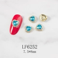 Detailed view of heart-shaped nail charm LF6252 with blue sapphire and gold base - Blue Heart Gold Base (6252)