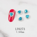 Detailed view of sea blue heart nail charm with small diamonds on red false nail - Blue Heart Silver Base (6273)