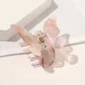 Macro view of butterfly hair claw clip with pearlescent pink and purple gradient finish - Mermaid Pink Butterfly Claw