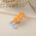 Detail of star-shaped cookie hair clips with blue gingham bow on cream tray - Bowknot Biscuit-Star