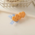 Detail showing heart-shaped biscuit hair clips with blue checkered ribbon on a tray - Bowknot Biscuit-Heart