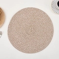 Detail of round woven placemat showing two-tone brown and white texture on white table - Coffee & White