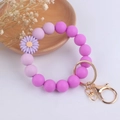 Detail of purple silicone beaded keychain bracelet with daisy charm and gold clasp - Light Purple Small Daisy
