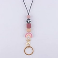 Detailaufnahme der Perlen-Lanyard mit Silikonperlen, Holzelementen und Regenbogen-Anhänger - Rosa
