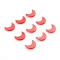 Close-up of nine red moon-shaped acrylic pendants for DIY jewelry and crafts - Gold & Pink