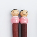 Japanese style wooden chopsticks featuring cute pink doll heads and hand-painted faces - Daughter