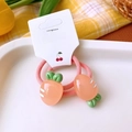 Close-up of pink elastic hair ties with carrot resin charms on a display card - Carrot Hair Ties Pair