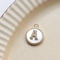Close-up of gold-plated letter A pendant with shell inlay and cubic zirconia stones - A Round