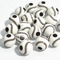 Close-up of white acrylic baseball beads with brown stitching texture for DIY jewelry - 12mm Baseball White Background Coffee Line