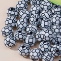 Macro view of black and white acrylic soccer ball beads with pre-drilled holes for DIY jewelry - 10mm Soccer White/Black Line