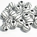 Macro shot of 50 black and white basketball-shaped acrylic beads with pre-drilled holes - 12mm Basketball White Background Black Line