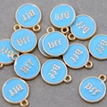 Detail of round light blue enamel BFF charms with gold edges for DIY jewelry making - Sky Blue