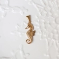 Detailed close-up of a 18K gold-plated seahorse pendant with polished finish details - G04-Seahorse