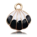 Macro detail of gold-plated shell pendants with black and white enamel stripes and ring - Black
