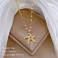 Dettaglio collana stella marina dimensioni 2,5x2cm e peso 3,6g su seta bianca - Stile Stella Marina Rotante Oro (C416)
