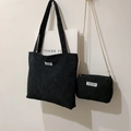 Detail of black corduroy tote bag set with small gold chain pouch and fashion label - One Size / Tote Bag And Chain Bag / Black