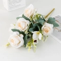 Detail of faux white roses bouquet with green leaves and realistic silk petals - Champagne